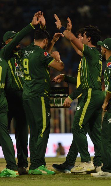 Team green celebrates their wicket